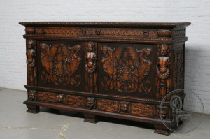 картинка Антикварный комод с объемной резьбой с мифологическим сюжетом салоне старинных вещей "Шебби" являющийся официальным дистрибьютором в России и Беларуси