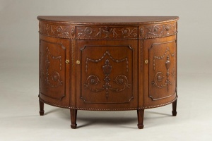 картинка Старинный полукруглый комод с резьбой в античном стиле салоне старинных вещей "Шебби" являющийся официальным дистрибьютором в России и Беларуси